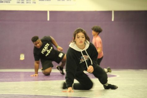 Last year, then-freshman Joy Cantu works on a drill with the wrestling team. Now she will be helping other girls launch their own team.
