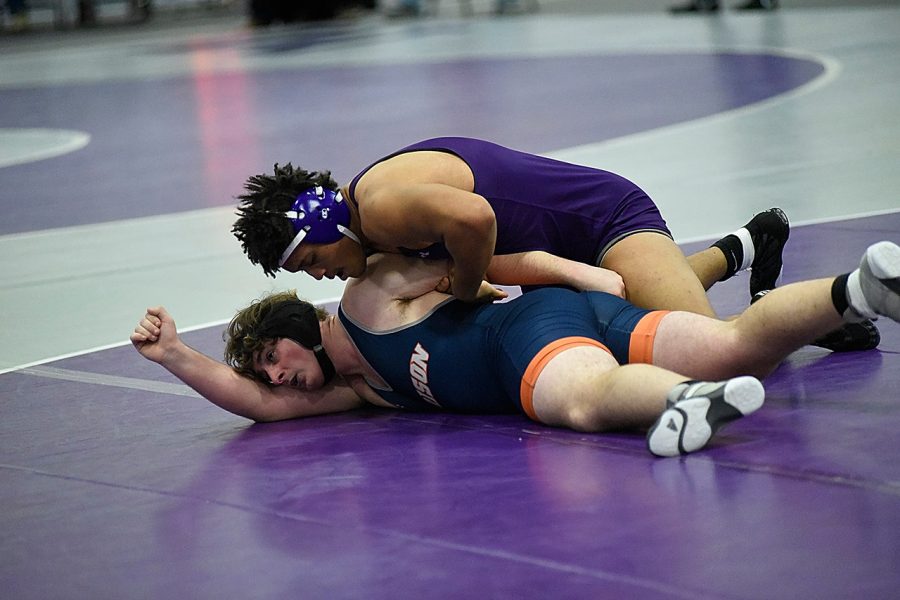Senior Theodore Sparks scores a victory against an Anderson wrestler earlier this year.