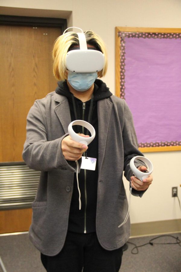 Senior Leo Fernandez demonstrates his VR oculus headset.