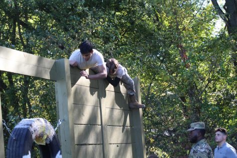 Senior Ivan Osorio climbs over the wall during one of the events at the recent Raiders competition.
