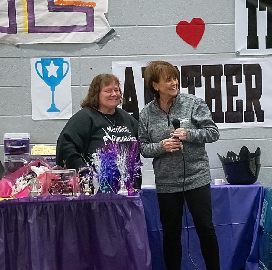 Coach Diane Roberts is honored by Athletic Director Janis Qualizza before Thursday nights meet.