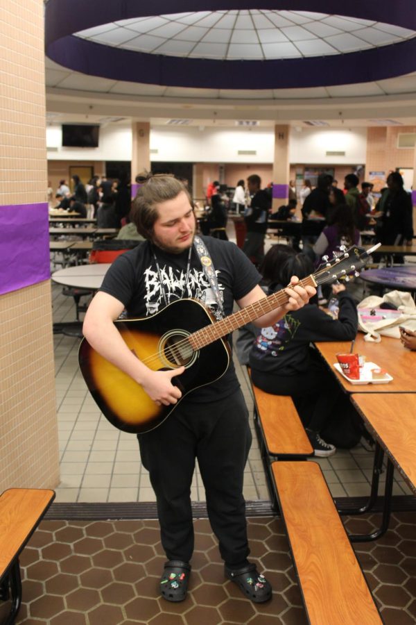 Sophomore enjoys playing guitar for his friends and classmates.