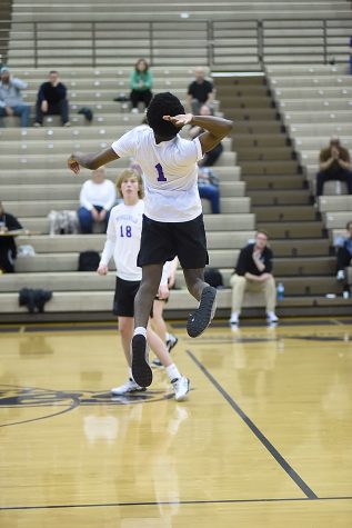 Senior Jordan Jones jumps to spike the ball during a recent volleyball game.