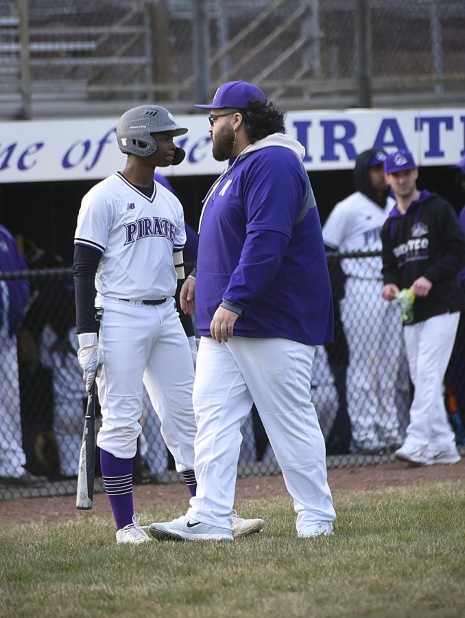 Coach Carbajal talks with Freshman Kaleb Henry during a recent game.