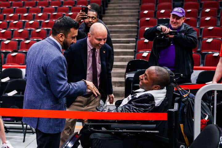 Senior Omarion Thomas talks with Bulls announcers at the teams final regular-season game.