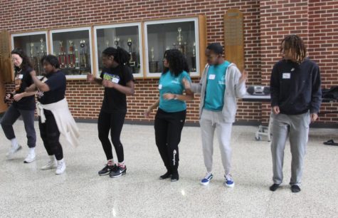 Facilitators work with their groups during the Cupid Shuffle activitity.