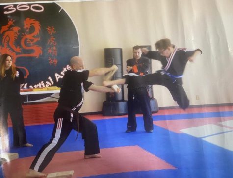 Hunter Frangis flies through the air during a karate practice.