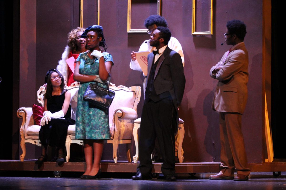 The cast of Clue practices a scene during their dress rehearsal Wednesday night.
