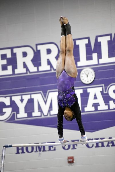 Caidyn Morgan performs on the uneven parallel bars. 