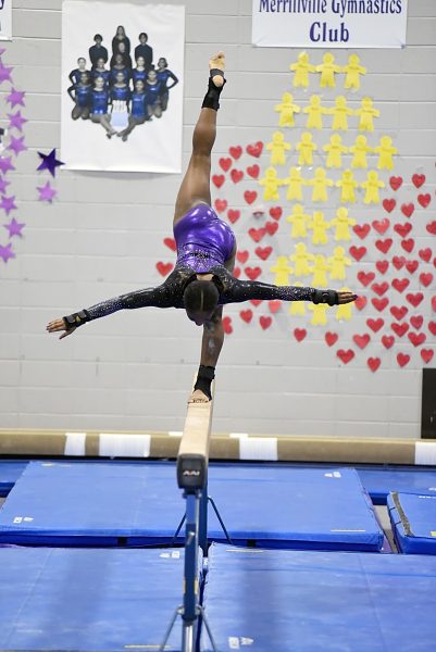 Saniya Lipscomb performs on the balance beam.