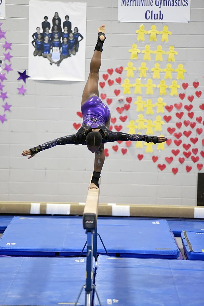 Saniya Lipscomb performs on the balance beam.