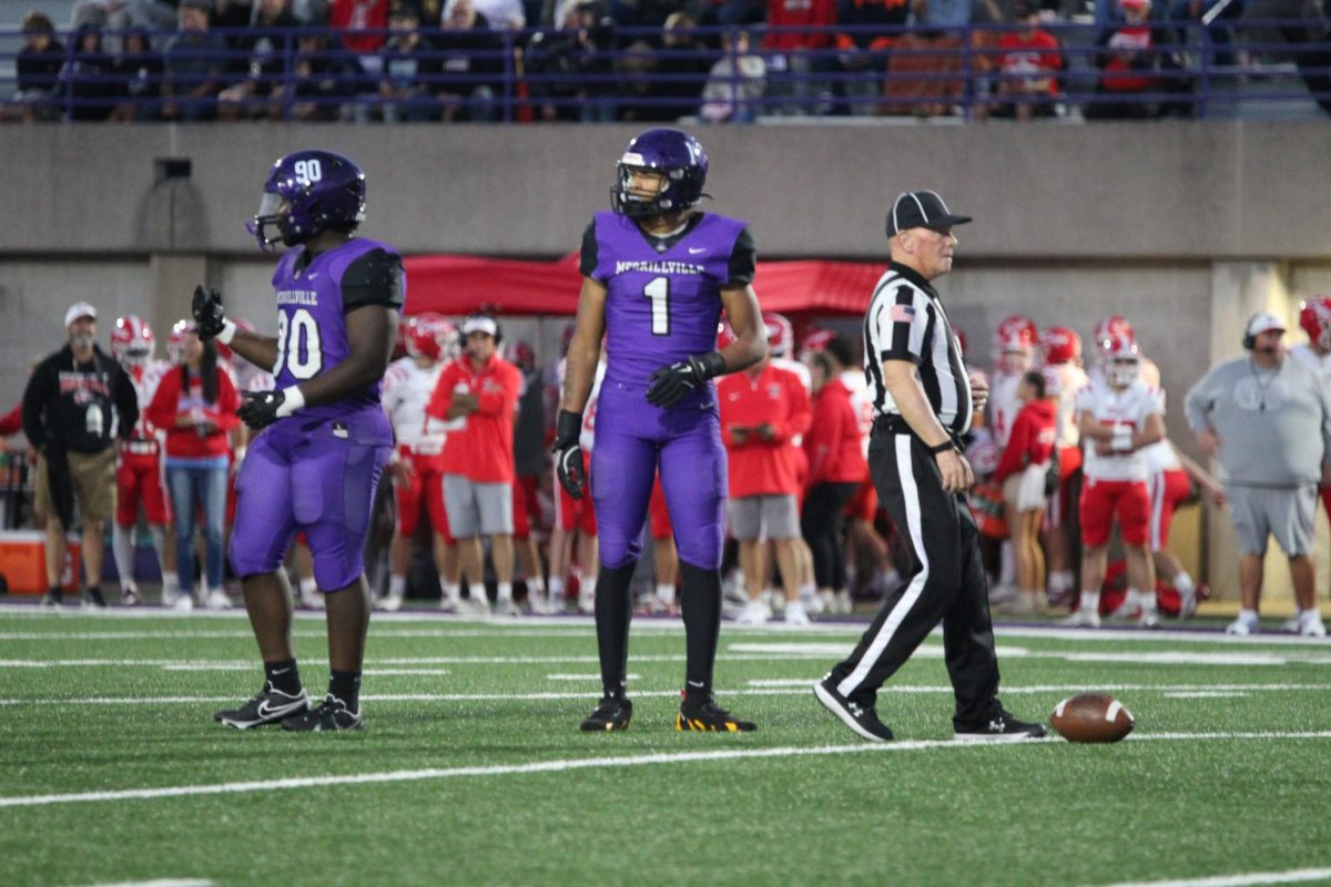 Trent Nixon receives instructions from the sidelines during the Crown Point game.