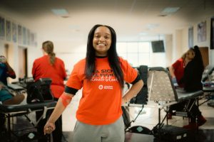 Katelyn Bell-Logan proudly shows off her bandage after donating during the recent blood drive. 