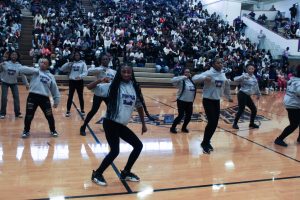 The step team performs during the Homecoming Pep Rally.