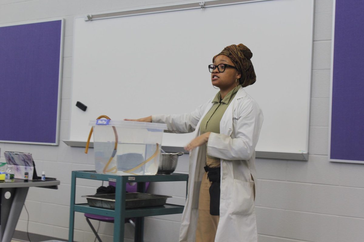 Graduate Aniya Edwards prepares to begin a demonstration on engineering for current MHS science students.