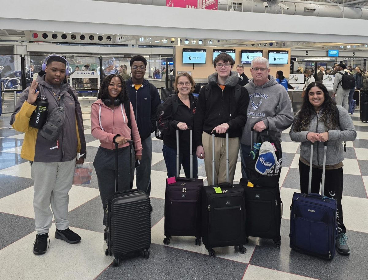 Aiden Jackson, Peace Finley, Avion Matthews, Tyler Hasley, his parents, and Amy Shollenberger at the airport to leave for the Galapagos Islands.