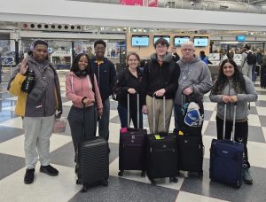 Aiden Jackson, Peace Finley, Avion Matthews, Tyler Hasley, his parents, and Amy Shollenberger at the airport to leave for the Galapagos Islands.