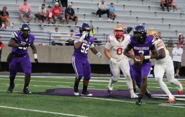 Quarterback Michael Hill runs with the ball during the victory over Andrean in Week 1.