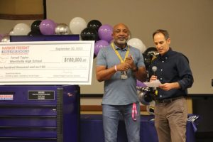 Mr. Taylor receives his award from the Harbor Freight Tools representative. 