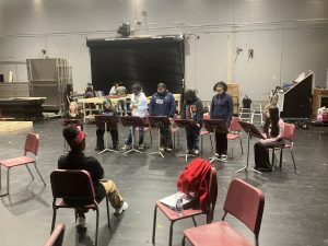 Members of the Thespian Troupe practice with Ms. Mia Godfrey for their performance of a series of staged readings on gun violence.