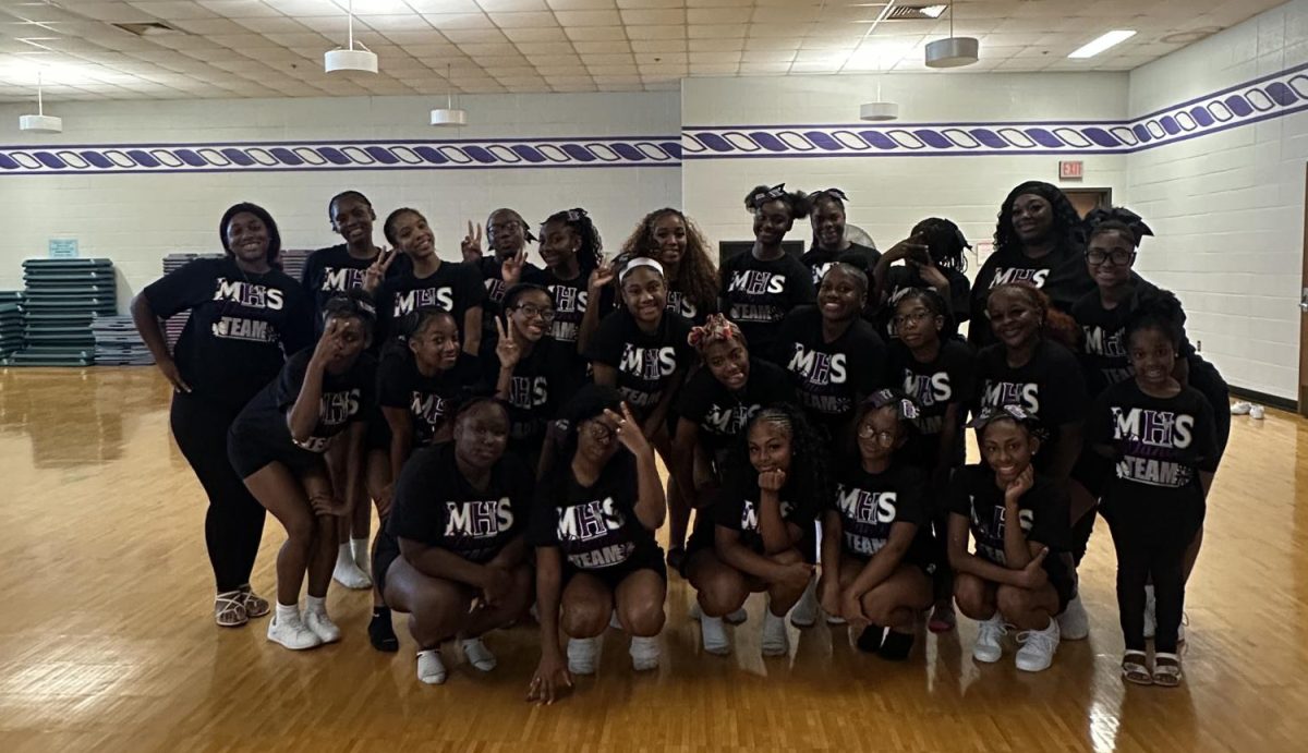 Members of the Dance Team pose for a photo at the end of the UDA competition.