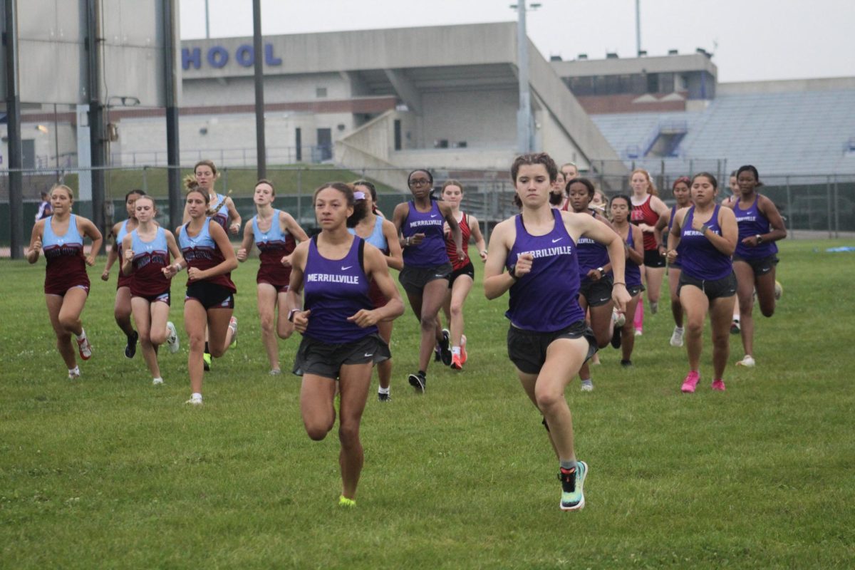 Amity Lauzon, right, and Meagan Thomas lead the pack in a recent Cross Country meet at MHS. Lauzon is the new Sectional Cross Country champion.