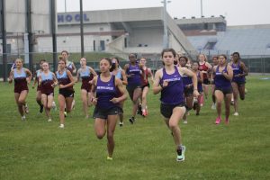 Amity Lauzon, right, and Meagan Thomas lead the pack in a recent Cross Country meet at MHS. Lauzon is the new Sectional Cross Country champion.