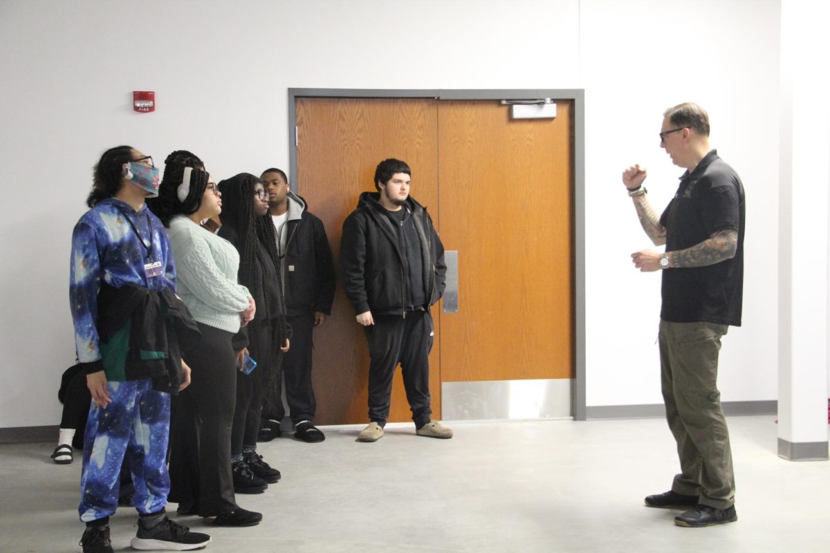Mr. Mark Gregoline instructs his criminal justice class before a gun simulation.