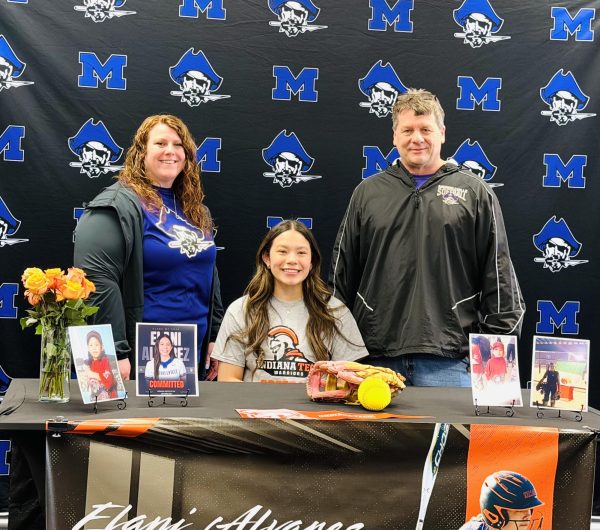 Elani Alvarez poses with her coaches Amber Welsh and Adam Fricke after signing to play softball at Indiana Tech.